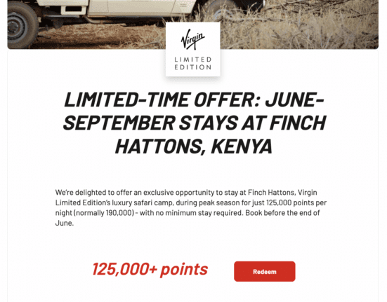 a white truck with black text and red text